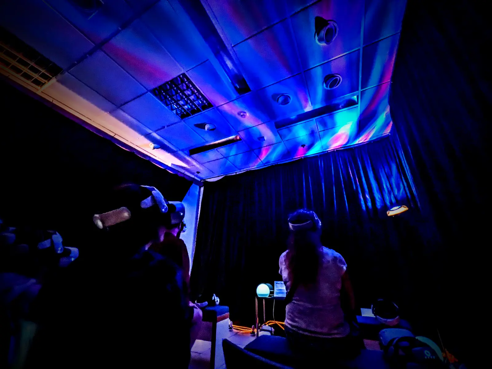 Interior view of the lab's dedicated Virtual Reality zone, featuring immersive lighting, and headset stations.